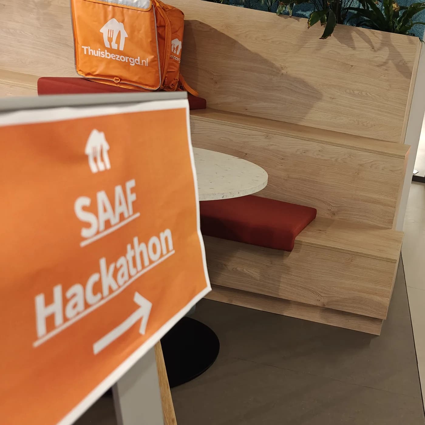 A SAAF Hackathon sign pointing the way in