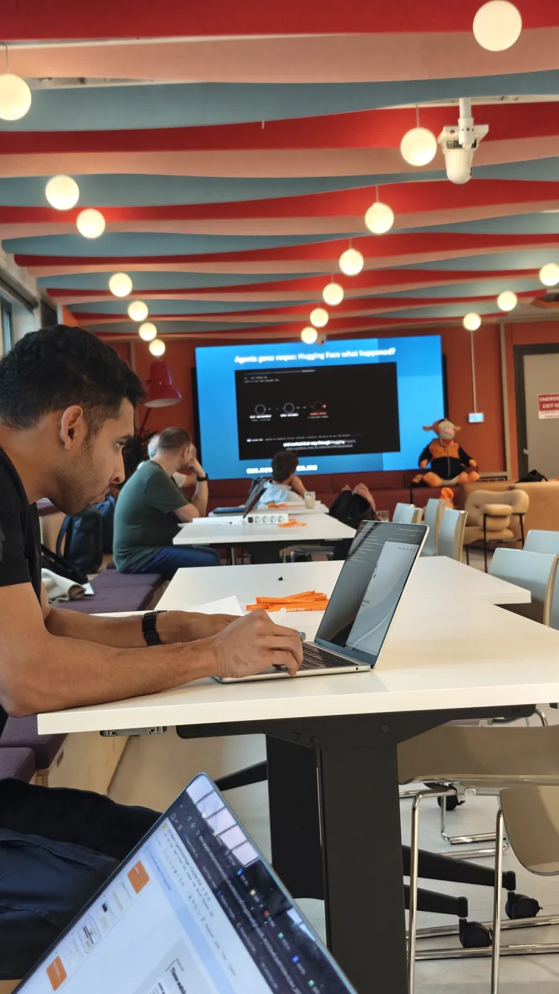 A builder at his laptop during the morning talks